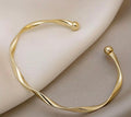 Twisted Gold Cuff Bangle – Enchanted Elegance